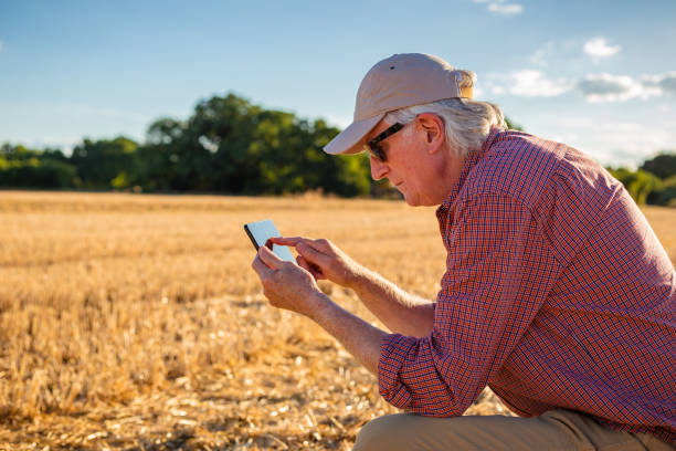 istock Farmers working on the land and checking crops 1413873526