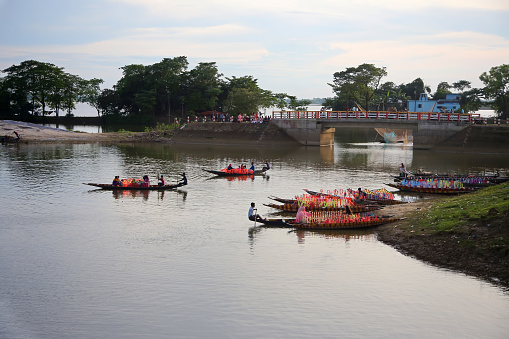 Tourists are entering the small dinghy boats arranged at the ghat. Tourists are going around by boat to enjoy the beauty of Haor at rural area in Bangladesh.The haors in Sylhet are now full of water, the beauty of the haors increases in monsoons. August 5, 2022, Sylhet, Bangladesh.