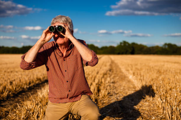 istock Farmers working on the land and checking crops 1413873631