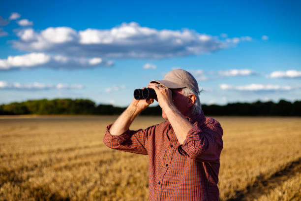 istock Farmers working on the land and checking crops 1413873637
