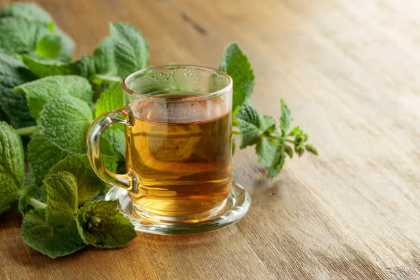 istock Mint tea on a wooden table. 1413875216