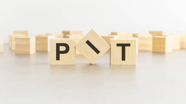 istock letters PIT on wooden blocks, white background 1413877507