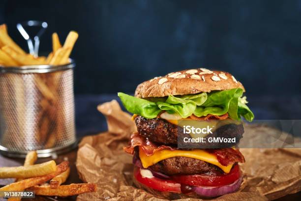 Double Beef Burger With Tomato Cheese Bacon Onions And Lettuce Stock Photo - Download Image Now