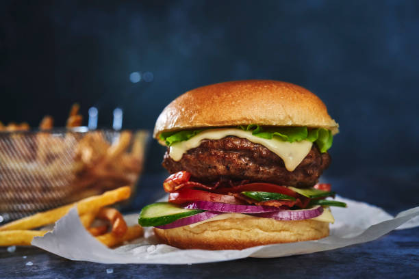 istock Double Beef Burger with Tomato, Cheese, Bacon, Onions and Lettuce 1413878846