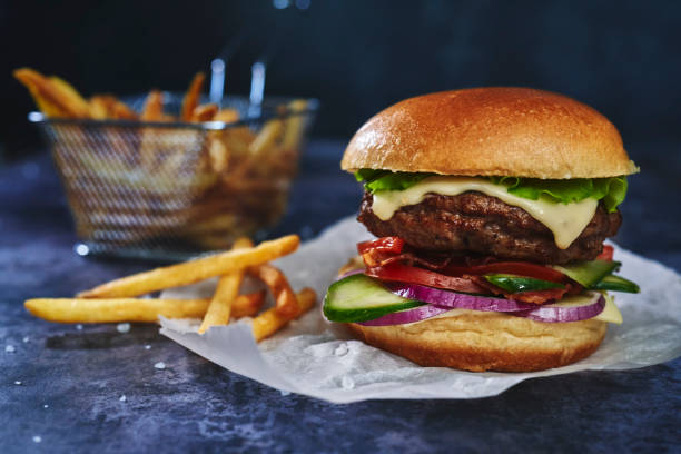 istock Double Beef Burger with Tomato, Cheese, Bacon, Onions and Lettuce 1413878871