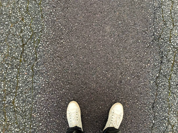 istock View from above on a man's feet on the road 2 1413880962