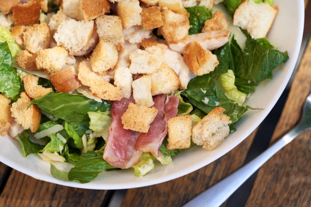istock Caesar salad with croutons, lettuce, bacon and chicken 1413881000