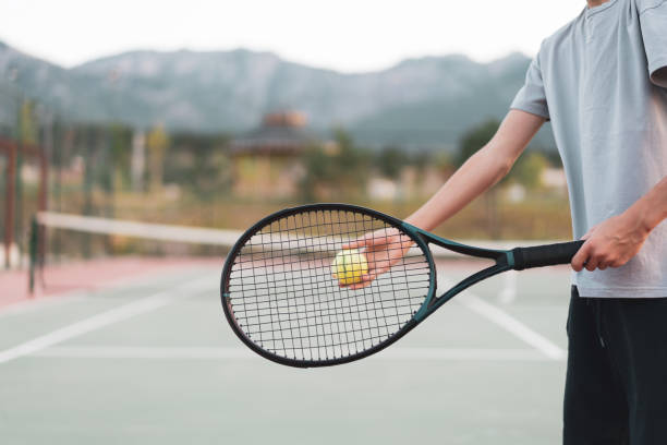 istock Rear view young boy starting tennis set 1413884061