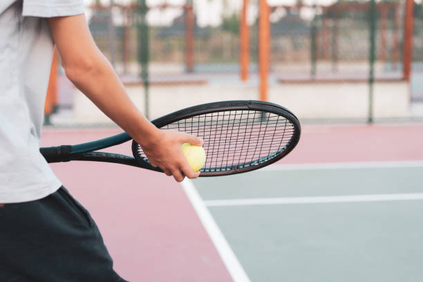 istock Rear view young boy starting tennis set 1413884111