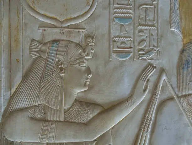 wall relief of goddess Isis in the Temple of Seti I at Abydos . Sohag . Egypt .