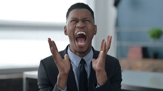 Portrait of Young African Businessman Shouting, Screaming