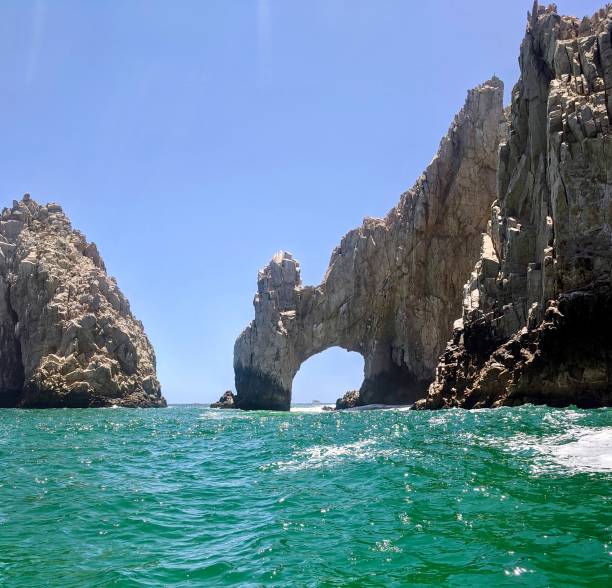 istock Natural stone arch into all the 1413885537