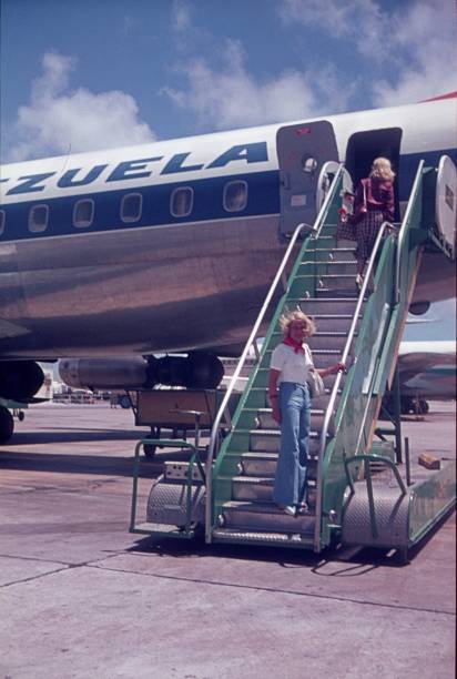 Bridgetown, Barbados, 1976. Passengers board a plane at Grantley Adams International Airport in Bridgetown.