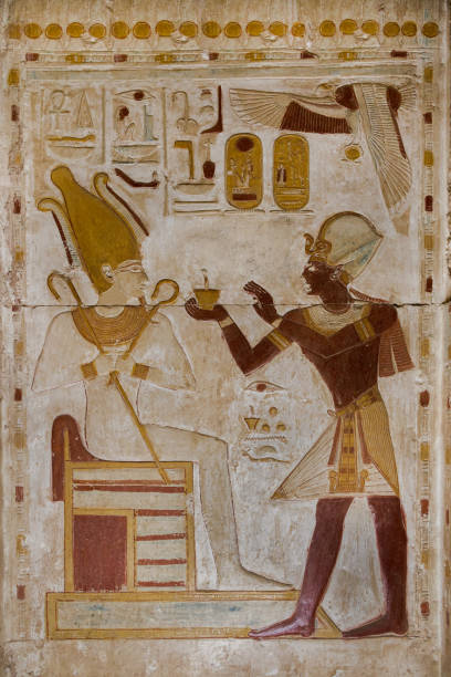 wall relief of pharaoh Seti I  offering to the god Osiris at Abydos temple.  Egypt. wall relief of pharaoh Seti I  offering to the god Osiris at Abydos temple.  Egypt. abydos stock pictures, royalty-free photos & images