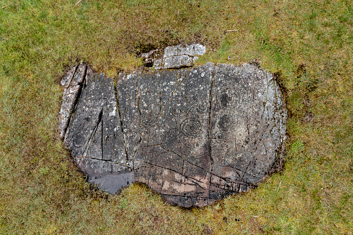 Kilmartin Glen, Cairnbaan rock art, viewed from a low level overheadaerial drone position, in Argyll & Bute, on the west coast of Scotland, close to the coastal town of Lochgilphead. The mysterious carvings in the rocks are located in remote locations throughout the glen.