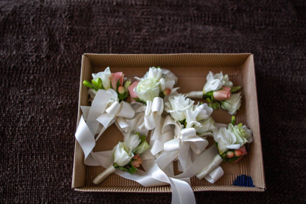 istock Set of wedding boutonnieres in a cardboard box 1413887946