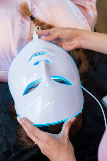 istock professional beautician performs facial procedure to her client 1413888600