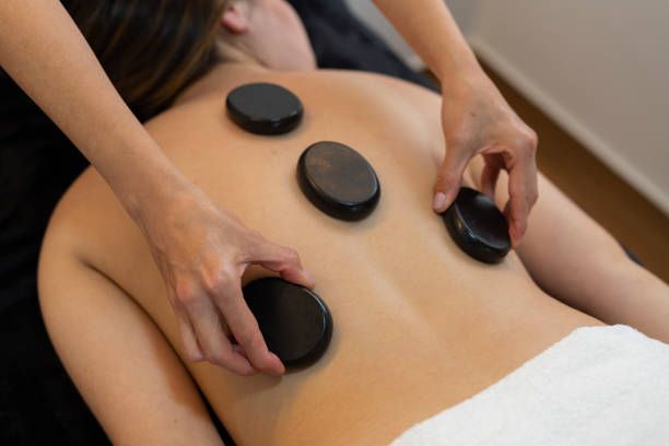 istock professional beautician performs a relaxing procedure to one of her clients 1413888716