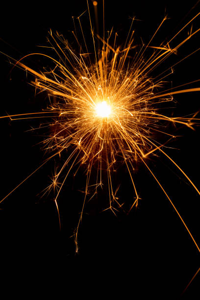istock Sparkler candle used in celebrations, black background, selective focus. 1413889867