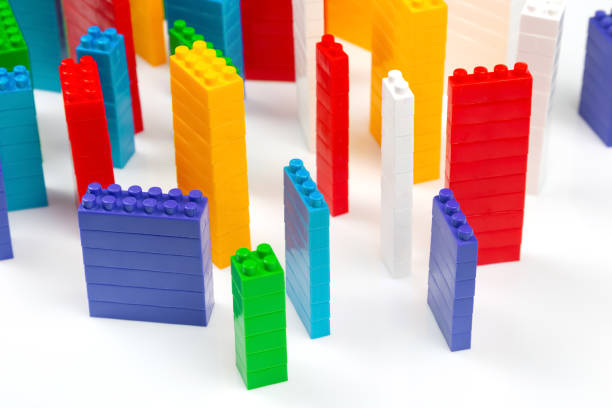 istock colored blocks of a plastic constructor on a white background in the form of multi-storey buildings. concept of modern buildings and houses 1413895128