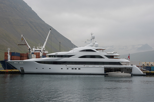 Isafjordur, Iceland - July 6. 2021: Isafjordur, Iceland - July 6. 2021: Luxury yacht in the port