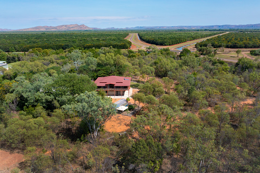 Wide Aerial of Residential House in North Western Australia, surrounded by trees, bush and irrigation canals