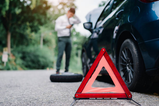 istock Asian businessman broken car engine breakdown his use mobile calling insurance smartphone problem, Accident emergency on the road concept. 1413902653