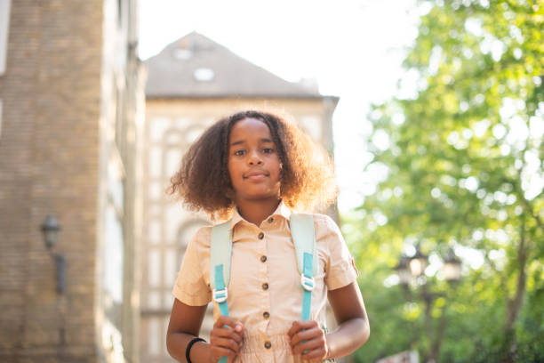 istock Happy school girl with a backpack 1413907578