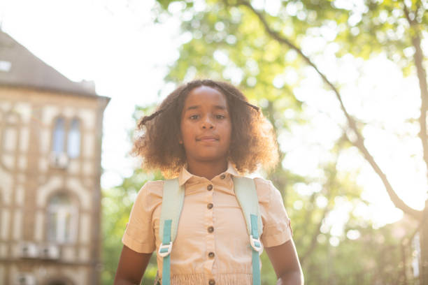 istock Happy school girl with a backpack 1413907581
