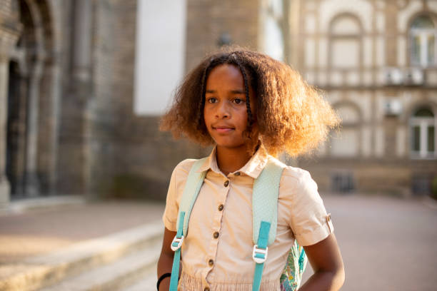 istock Happy school girl with a backpack 1413907588