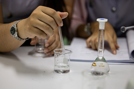 Scientist working Titration technique in the laboratory.