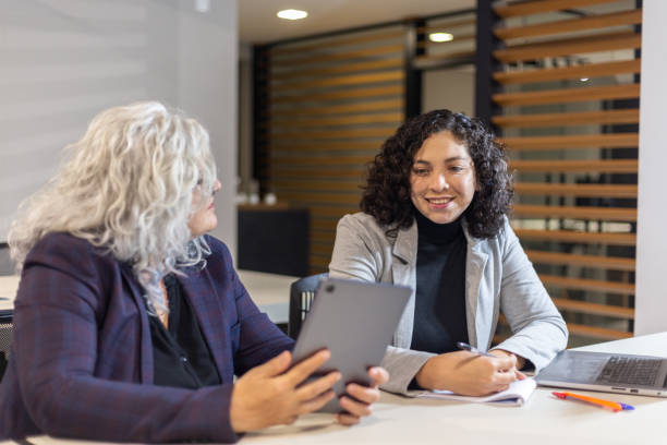istock Women in office work with laptop and tablet 1413920961