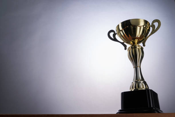 istock golden trophy against gray background 1413924498