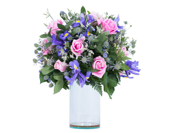 istock Flowers arranged in a bouquet set in a vase, on a white screen 1413925713
