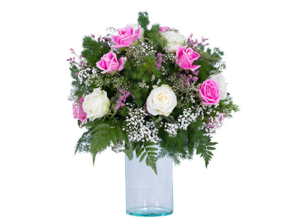Flowers arranged in a bouquet set in a vase, on a white screen