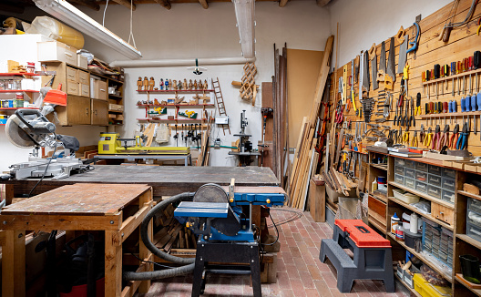 Carpentry workshop at a house garage with tools and no people