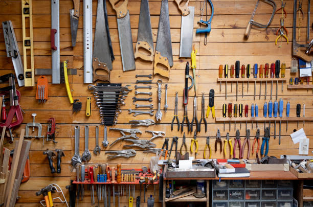 tools hanging at a carpentry workshop - nobody hammer home improvement work tool imagens e fotografias de stock