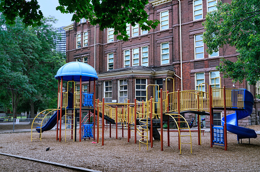 School playground equipment and wood chips on the ground for safety