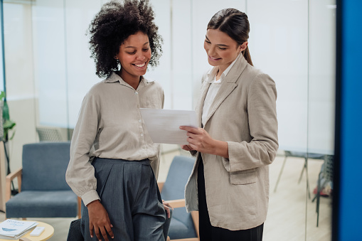 women talking in a coworking space