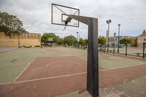 Basketball Court at Rethymnon Town on Crete, Greece, with identifiable writing in the background.