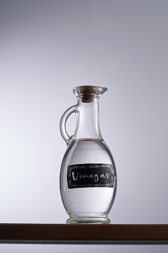 white vinegar against gray white background
