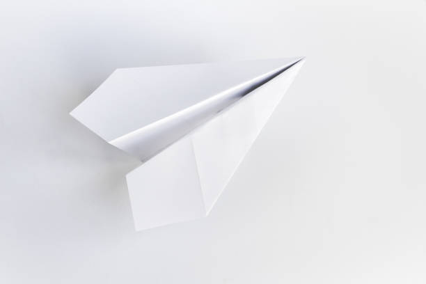 istock Paper plane origami isolated on a white background 1413944515
