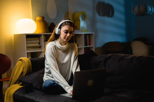 istock woman relaxing at home. evening scene 1413946838