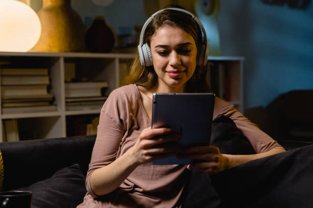 istock woman relaxing at home. evening scene 1413946842