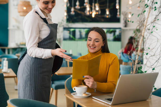 istock woman ordering food in restaurant 1413947160