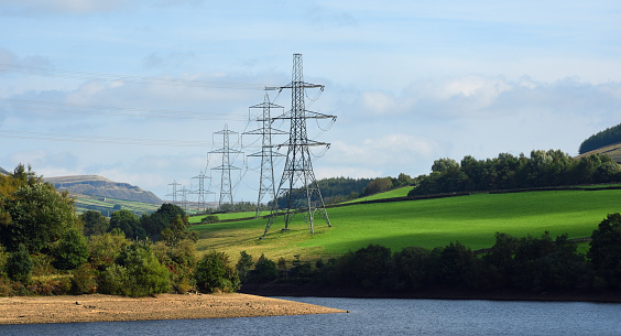 Electricity Pylons in the Peak District National Park close to Bottoms Reservoir  and Hadfield Derbyshire.