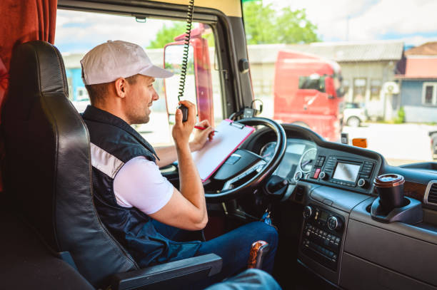 istock Professional truck driver CB talking 1413955571