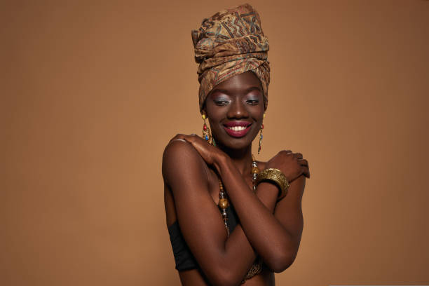 istock Smiling young slim black girl hugging herself 1413956770