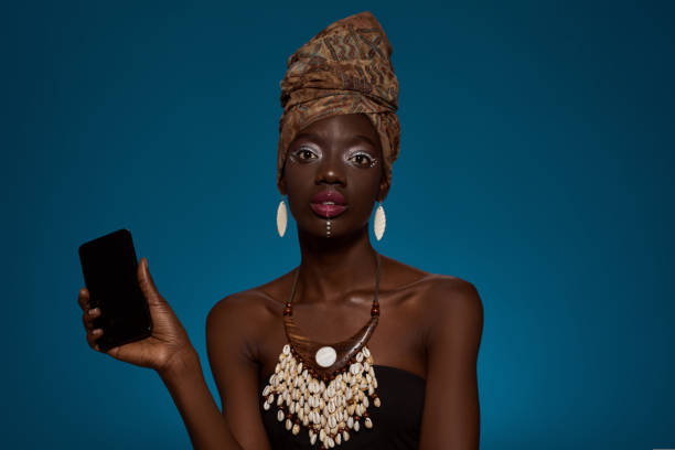 istock Black girl with smartphone looking at camera 1413958024