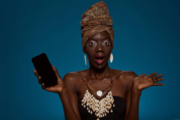 istock Shocked black girl with smartphone look at camera 1413958892